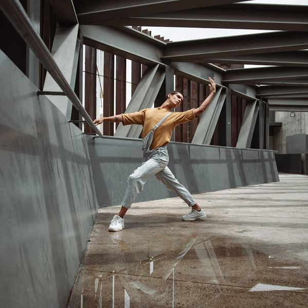 Man holding a kettlebell, demonstrating good form and balance.